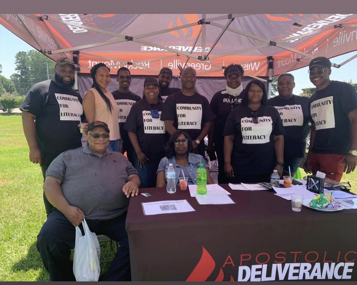 Community volunteers gathered together at an outreach event