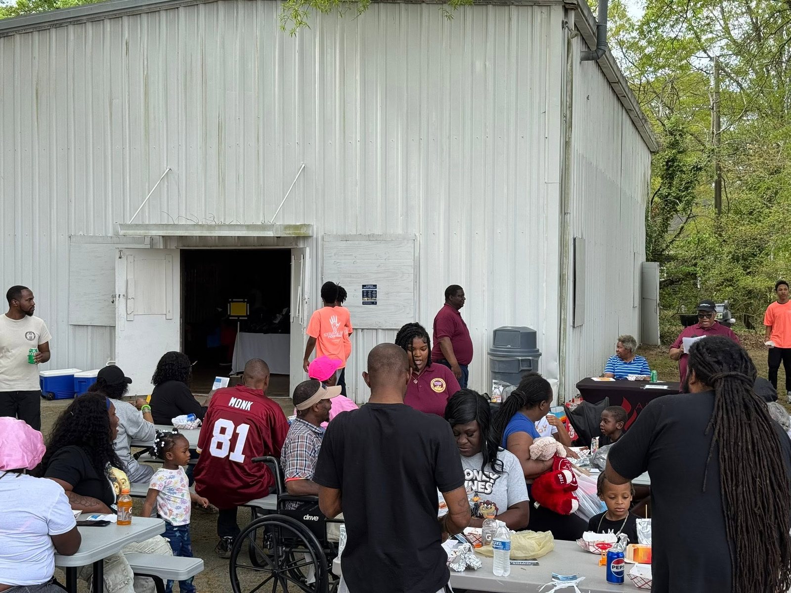 Families sharing food and fellowship at a community gathering